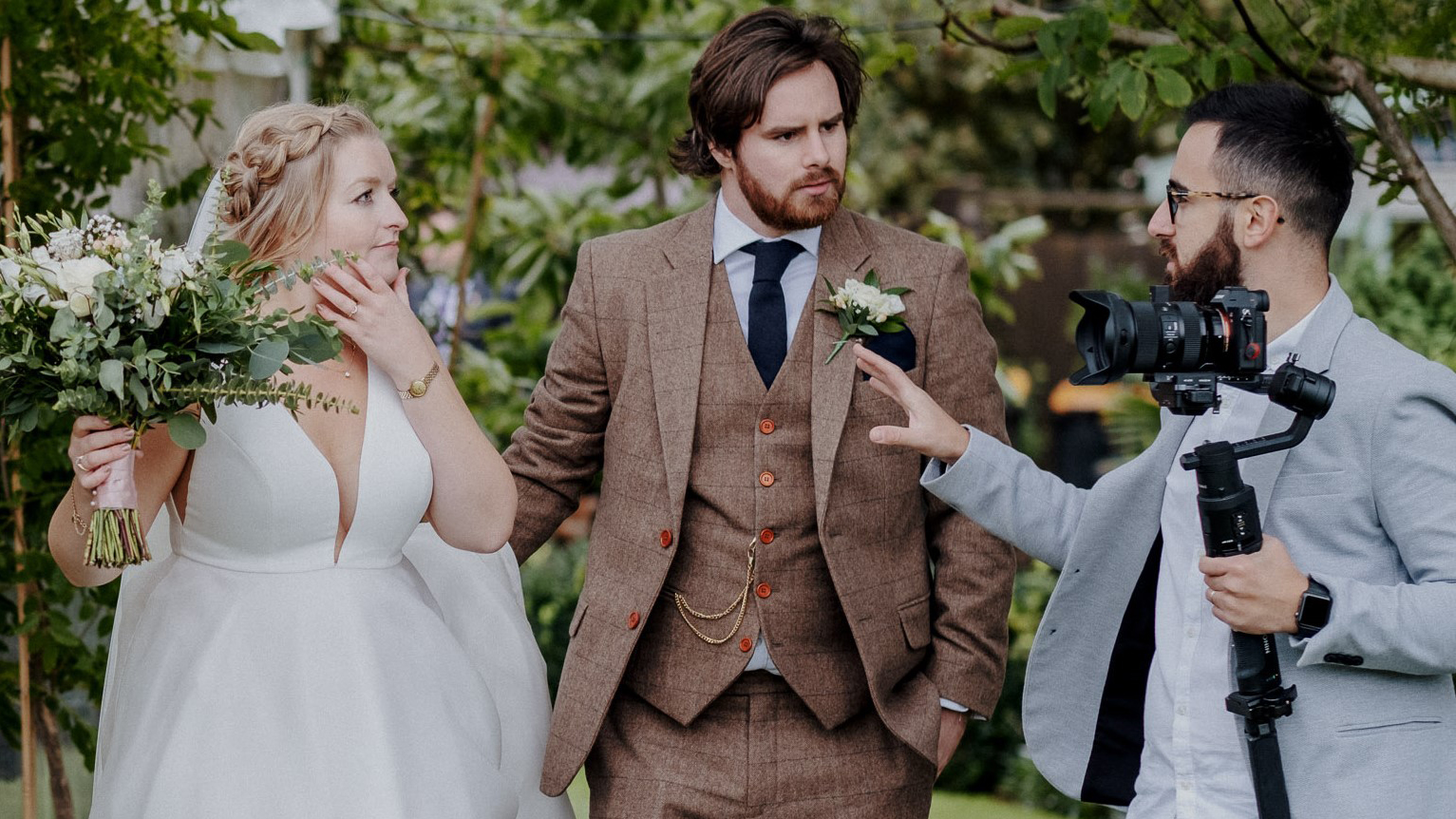 Gaetano di Giacomo, wedding videographer, directing a couple at their wedding.