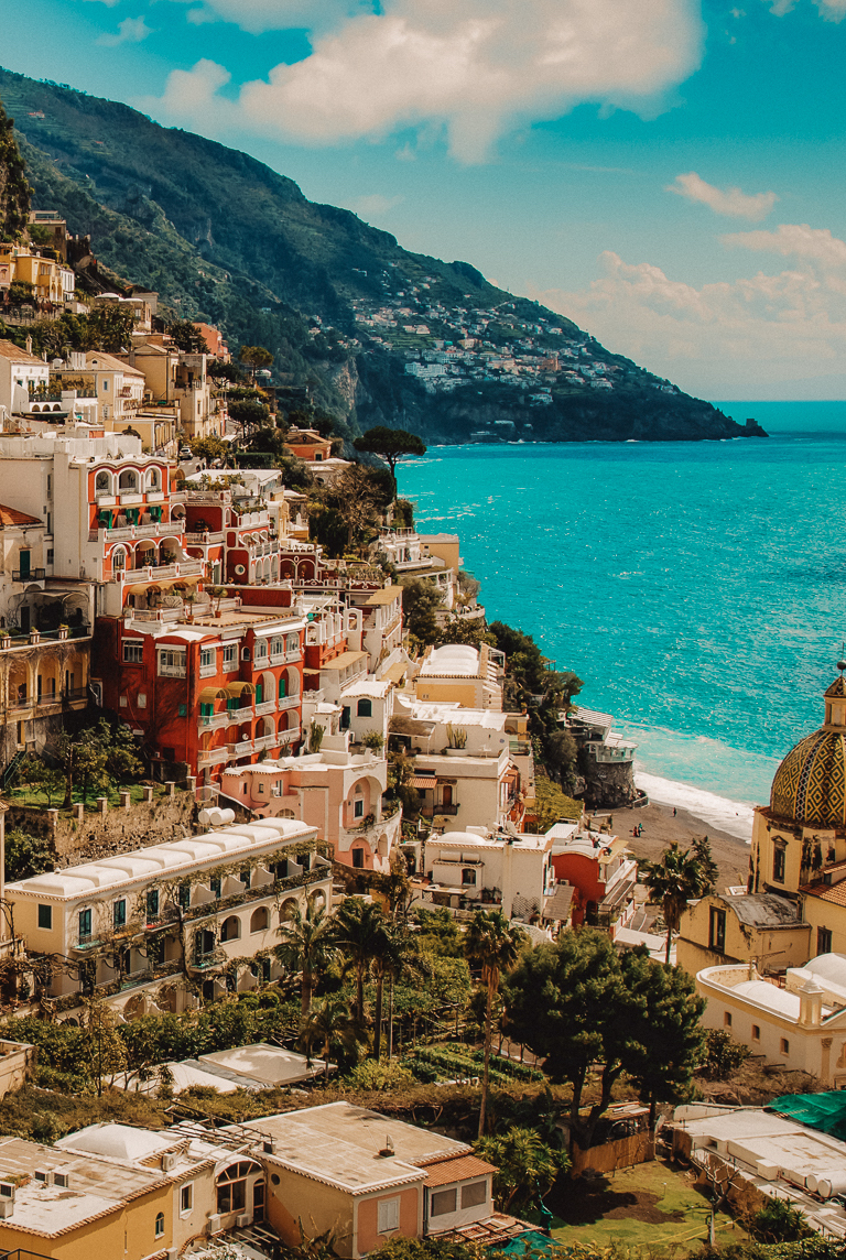 A high angle shot of the beautiful buildings by the Amalfi Coast captured in Italy