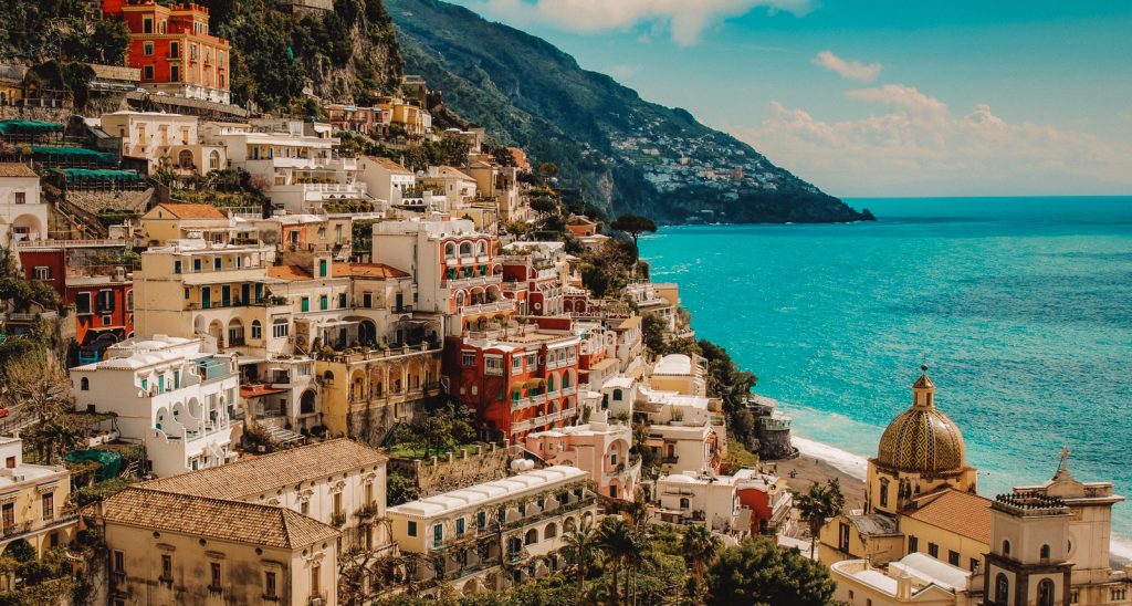 A high angle shot of the beautiful buildings by the Amalfi Coast captured in Italy